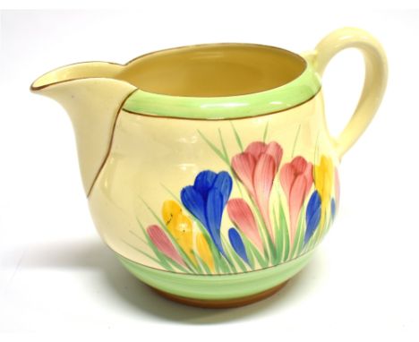 A WILKINSON CLARICE CLIFF 'HONEYGLAZE' JUG  painted in the 'Crocus' pattern, 11cm high