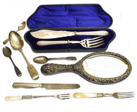 A SILVER BACKED HAND MIRROR AND MANY OTHER ITEMS the oval hand mirror embossed in high relief with a mask and a bird amidst f