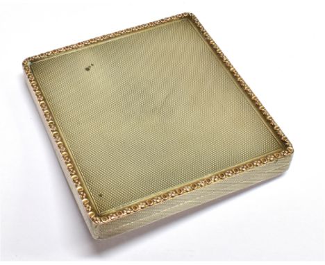 A SILVER ENGINE-TURNED 'SQUARE' CIGARETTE CASE WITH A RAISED AND FLORAL-CHASED GILT BORDER and with an internal inscription, 