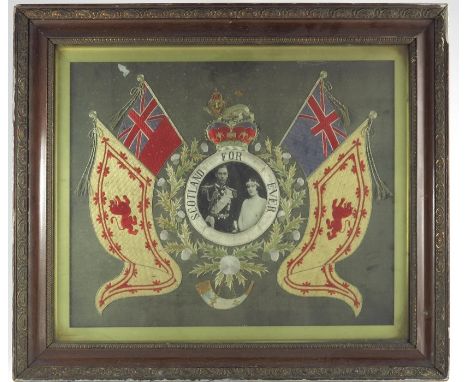 A George V gold thread embroidered picture, the central portrait of the Duke and Duchess of York, from 1928, within a disc ti