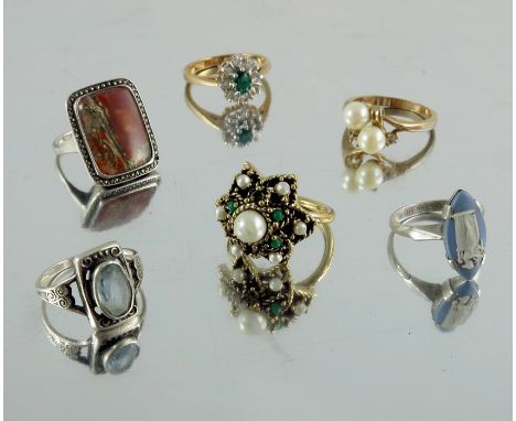 A collection of rings including 18 carat gold and white stone ring, 9 carat wedding band, 9 carat white gold eternity ring an