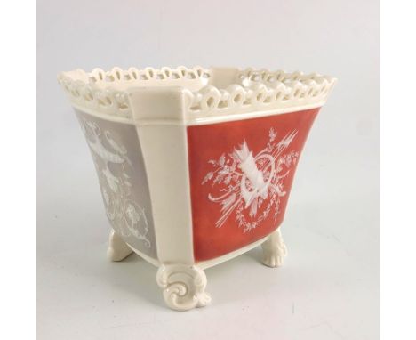 A Minton pate sur pate seau, circa 1880, flared and chamfered rectangular form, decorated with four panels of putti, foliate 