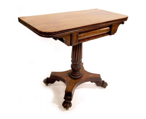 A William IV mahogany fold over pedestal card table, reeded and acanthus moulded column suport, on a quatrefoil and lions paw