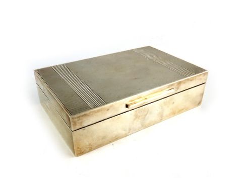 An Elizabeth II silver cigar box, Padgett and Braham, London 1965, in the Art Deco style, cuboid form with engine turned and 
