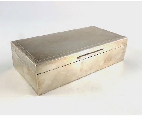 An Elizabeth II silver box, Garrard and Co., London 1971, cuboid form, the lid engine tuned with fluted borders, cedar lined 