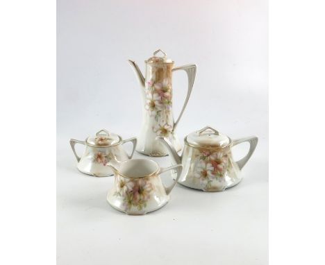 A Reinhold Schlegelmilch, R S Poland China four part tea and coffee service, decorated with roses and highlighted in gilt, in