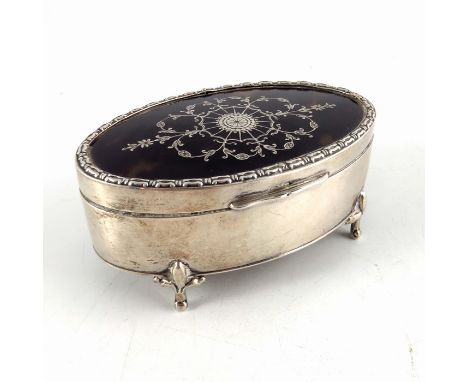 A George V silver and tortoiseshell jewellery box, Mappin and Webb, Birmingham 1911, oval form, the lid inlaid with foliate a