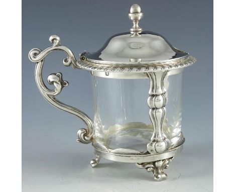 Emile Hugo, Paris circa 1860, a French silver mustard pot, cylindrical form with two cast baluster pilaster supports and a he