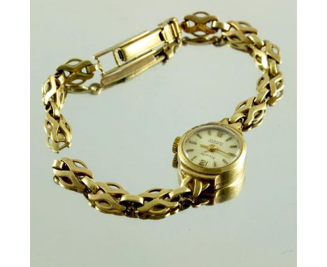A 9 carat gold Nivada ladies wristwatch on 9 carat chain bracelet, 13.1g