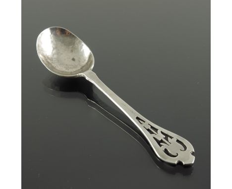 Sybil Dunlop, an Arts and Crafts silver spoon, London 1927, planished form, the pierced terminal with bluebell motifs, 10.5cm