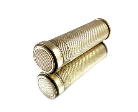 Cartier, an Art Deco silver gilt lipstick case, engine turned cylindrical form, signed Cartier Paris, 5cm long, 1.08ozt