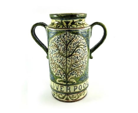 W Warwick for Della Robbia, an art pottery twin handled vase, circa 1895, cylindrical albarello form, sgrafito decorated with