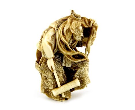 A Japanese carved ivory netsuke, Meiji, modelled as an Inari fox dancer, signed, 5cm long