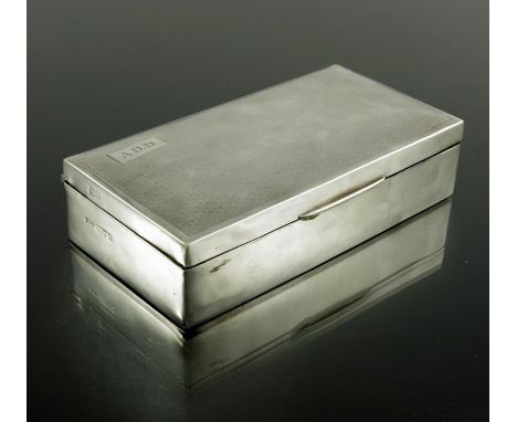 An Art Deco silver cigar box, Trevitt and Sons, Chester circa 1930, cuboid form with engine tunred cushion domed lid, cedar l
