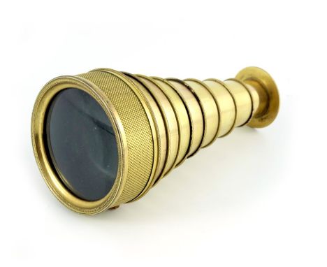 A George III gilt brass eight draw pocket field glass telescope, circa 1810, probably Berge of London, the outer ring with fi