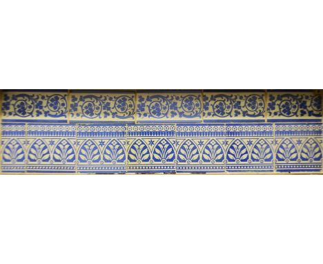 Christopher Dresser for Minton Hollins, a panel of six and a half blue and white tiles, below a further set of scrolling vine