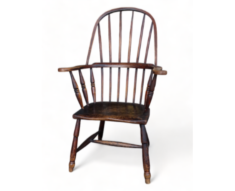 A 19th century ash, elm and beech 'Windsor' chair in the Penwith style - the hooped stick back with turned supports above a s