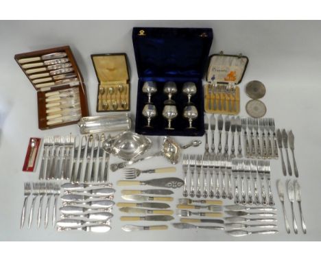 A quantity of silver plated wares - to include a ladle, a sauce boat, a sweetmeat dish, coasters and boxed sets of cutlery.
