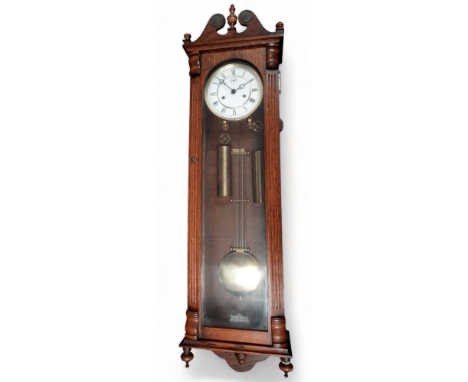 An early 20th century Viennese regulator style wall clock - of typical form, the white enamel dial set out in Roman numerals 