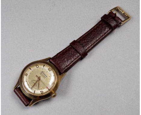 A Geneve gentleman's wristwatch - the silvered dial set out with Arabic numerals and batons, the second hand with red arrow, 