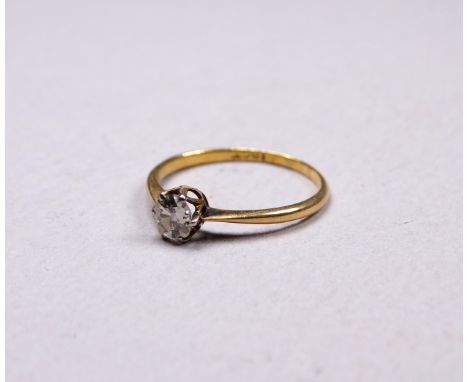 A solitaire diamond ring - the stone claw set in 9ct gold, size J/K, weight 1.2g.