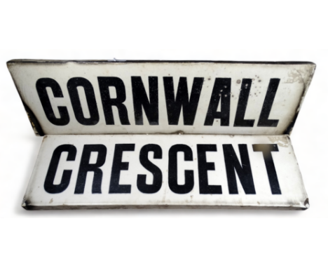 A late 19th century ceramic street sign 'Cornwall Crescent' - two sections with black Sans Serif text on a white ground, widt