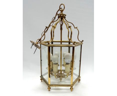 A Georgian style brass hexagonal hall lantern - height 59cm.