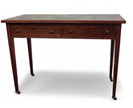 An Edwardian rosewood and inlaid writing table - the rectangular top with a green leather inset above an arrangement of two d