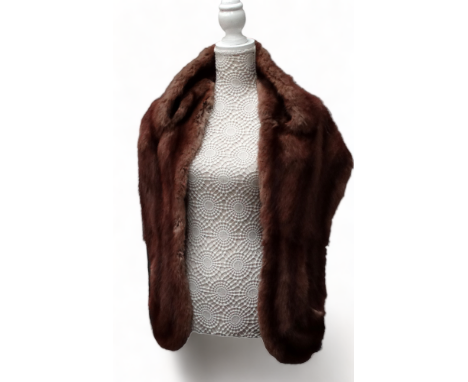 A fur stole - with light brown satin lining.
