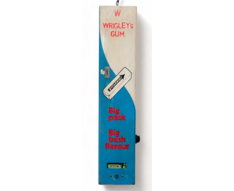 A Wrigley's vending machine - 5p in the slot, wall mounted in cream, blue and red colourway, width 21cm, height 90cm.