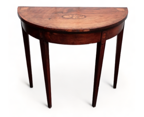 A George III mahogany and inlay D-shaped card table - the crossbanded top with oval shell inlay to centre and fan spandrels, 