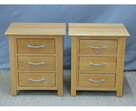 A pair of light oak bedside chests of drawers, W50 x D40 x H57cm