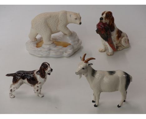 Four Royal Doulton figures including a spaniel with pheasants, polar bear DA155, Cocker Spaniel and goat