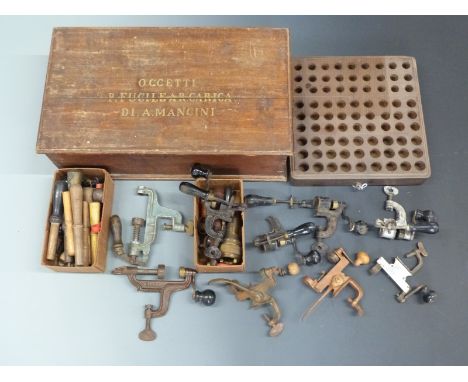 A collection of gunsmith's tools including nine roll over tools 12 and 16 bore cartridge board etc, all contained in a wooden