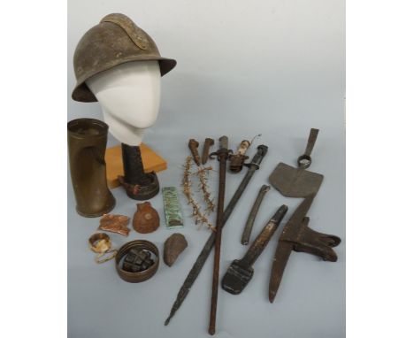 WWI French military helmet, two bayonets including a cruciform example and a quantity of artifacts from the trenches includin