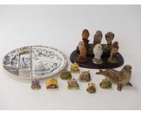 Beswick seal, six Royal Doulton owl figures on stand, eight miniature Lilliput Lane cottages and a plate