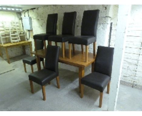 A contemporary light oak dining table and six leather chairs, W180 x D86 x H76cm