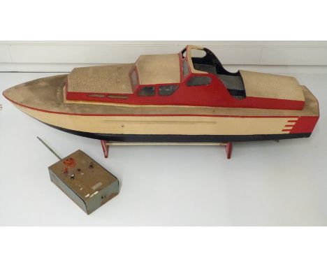 Vintage remote control wooden model boat with Taplin twin cylinder diesel engine and radio handset, 130cm long. 