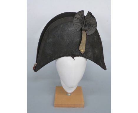 British Army 25th Regiment of Foot (King's Own Borderers) bicorn hat, edged in black tape with black rosette, regimental badg