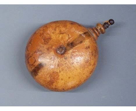 A powder flask in the form of a gourd with turned wooden stopper, 10cm long. 