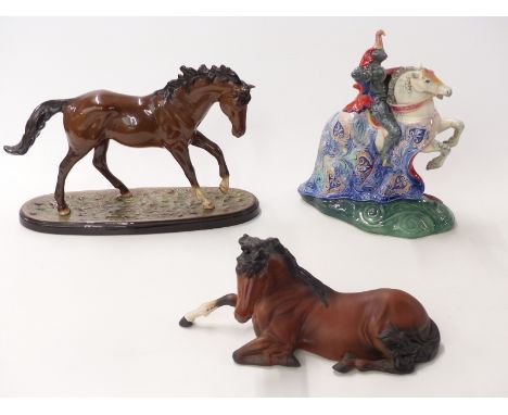 Three Royal Doulton racehorses including The Winner, and a boxed Beswick horse lying down, and a figure The Broken Lance