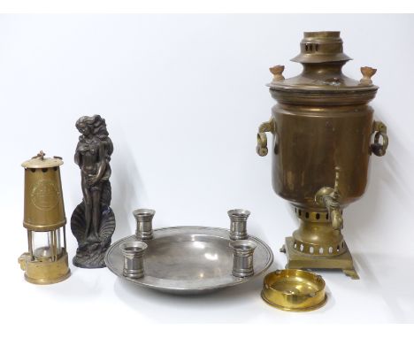 A pewter bowl with four integral candle holders, copper samovar, trench art ash tray and an Eccles type 6 miner's lamp 