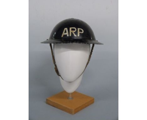 WWII ARP steel helmet complete with liner and chin strap