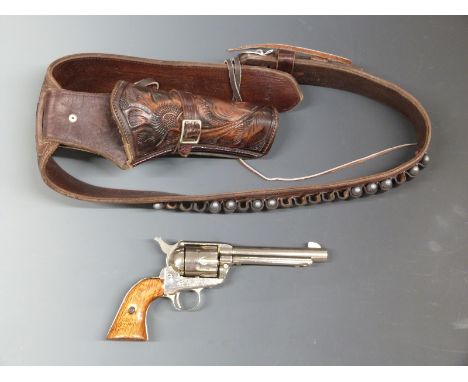 Replica MCF .44 six- shot singe action revolver in embossed brown leather holster with matching belt and replica bullets. 