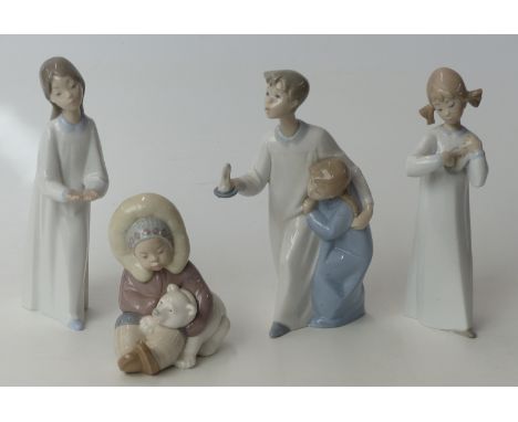 Four Lladro child figures including an Eskimo / Inuit figure with polar bear cub