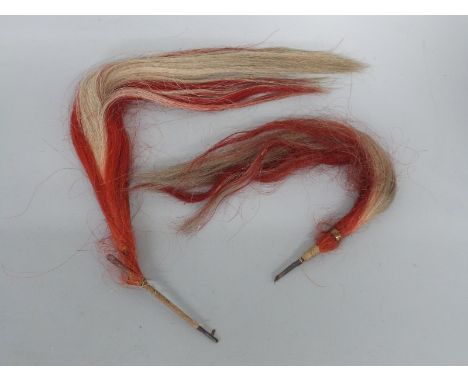 Two c1822 3rd (King's Own) Light Dragoons shako plumes, both red and white horse hair, approx 45cm and 70cm in length.  Forme