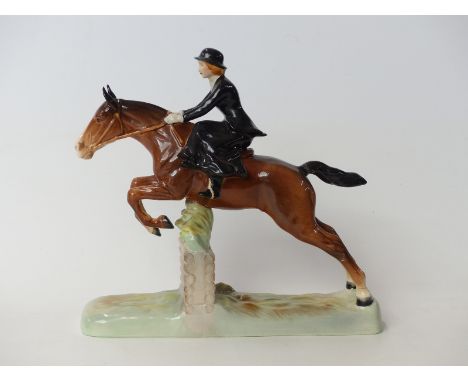 Beswick figure of a lady riding sidesaddle jumping a fence