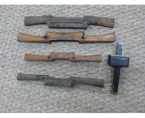 Four wooden spoke shaving tools and an ebony and brass cutting gauge stamped Randall CC 