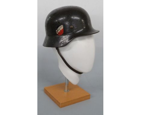 WWII Luftwaffe M40 double decal helmet with eagle carrying swastika to one side and crest to other, stamped to rim 1809 and Q