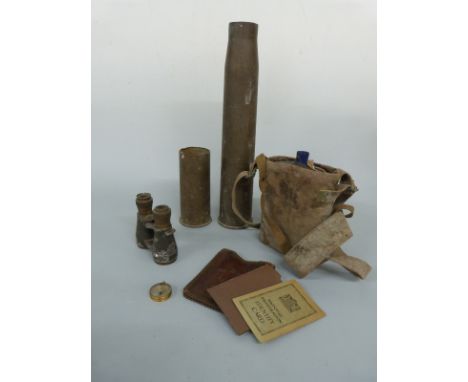 WWI enamel water flask in original webbing carrier, two shell cases, military binoculars, two identity cards etc 